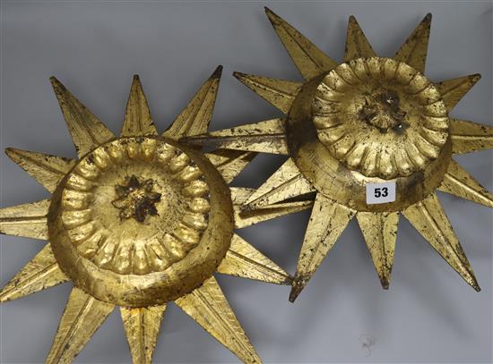 A pair of starburst ceiling lights